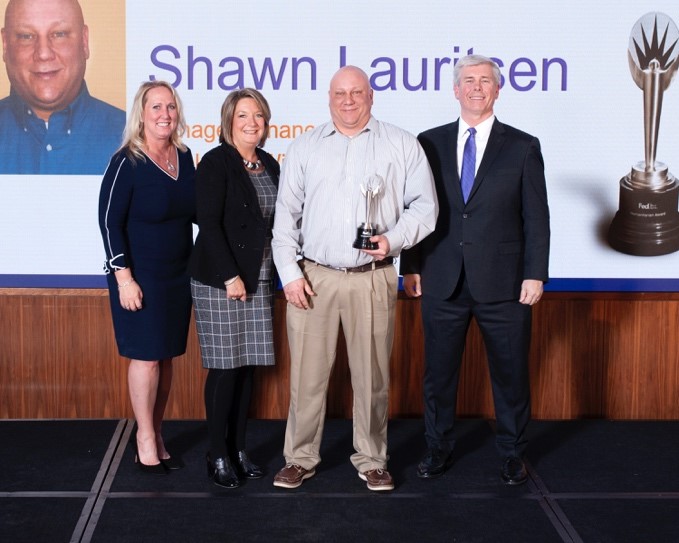 Team member accepting award