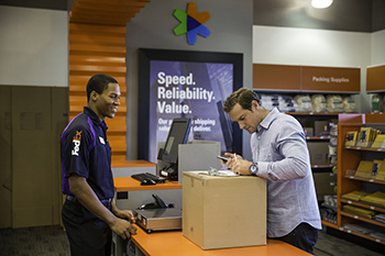 Customer shipping a package at FedEx Office