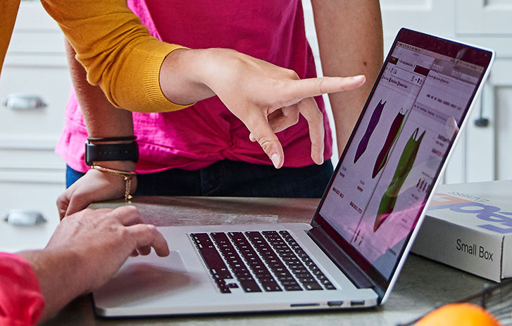 people using a laptop to shop online