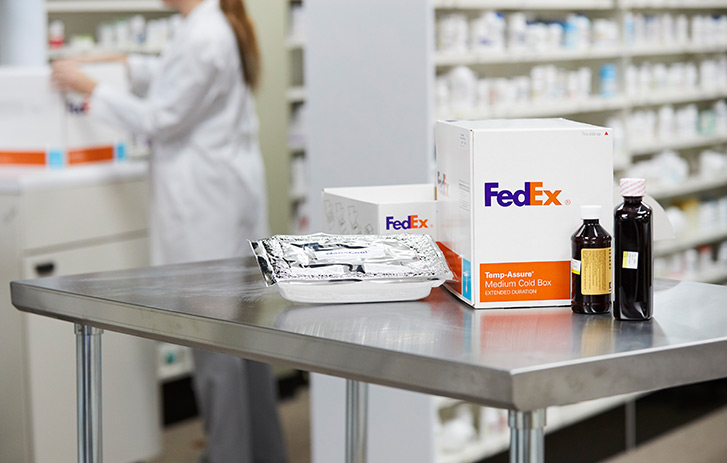 Image of medical supplies on a lab table next to a cold shipping box