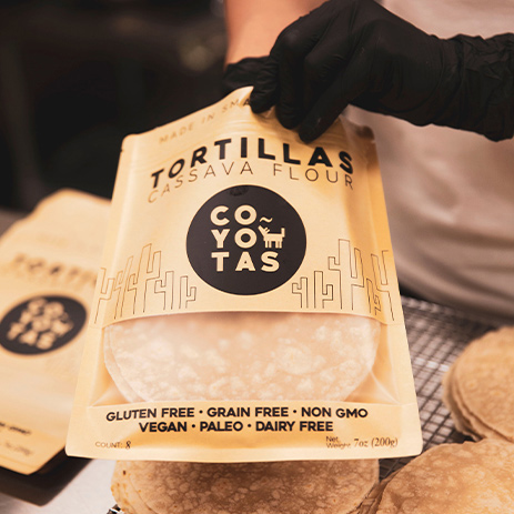 Home made tortillas being put in a bag