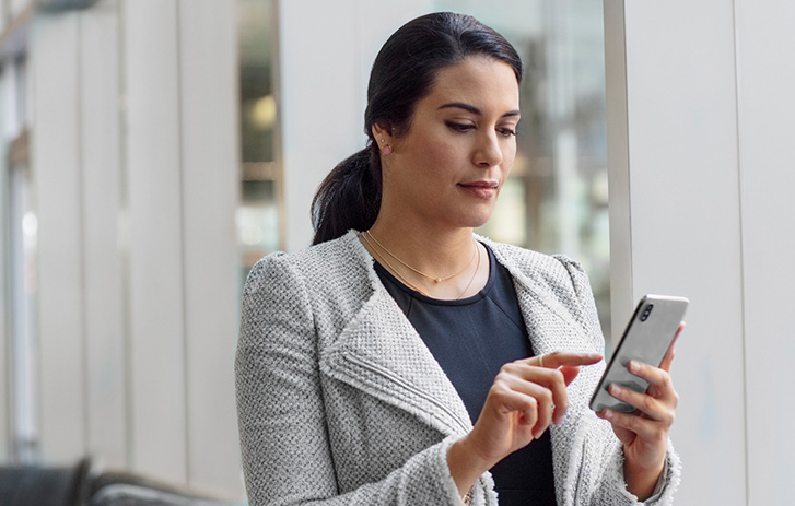 woman looking at mobile phone