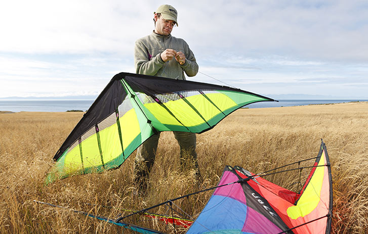 A person getting ready to fly some kites