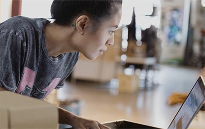 Woman looking at laptop