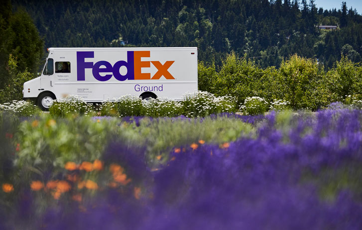 FedEx Ground Van driving down road