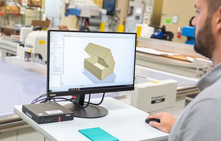 FedEx Packaging Lab employee designing custom packaging