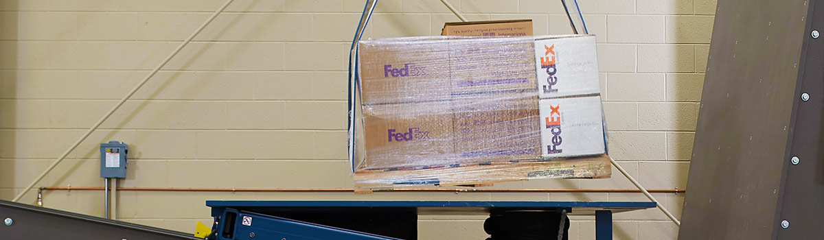 An image of a pallet of boxes getting tested in the lab