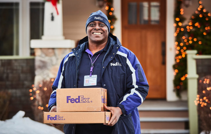 FedEx Courier picking up boxes from a residence