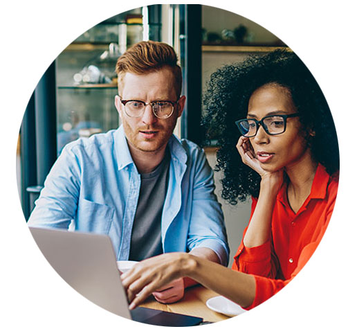 Defend against cyberthreats Woman and man using laptop computer