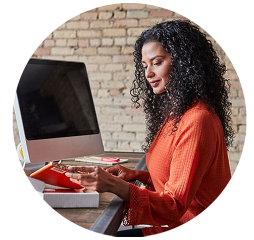 Taking ecommerce further, faster Woman sitting at computer