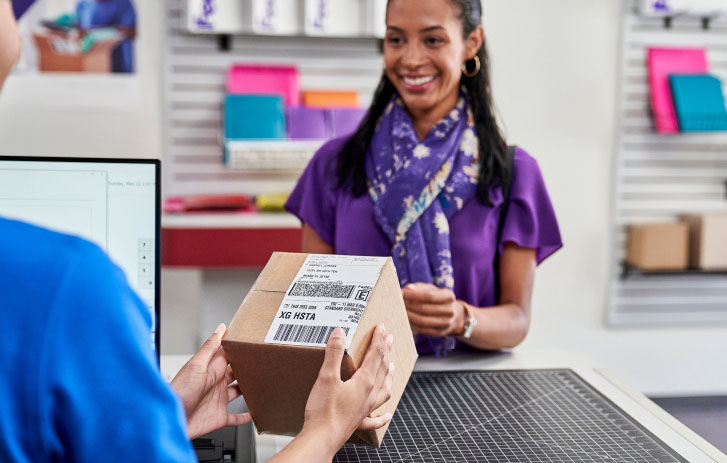 customer shipping a package at a FASC